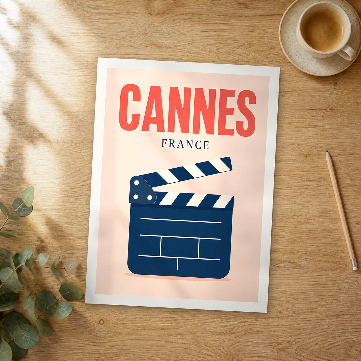 Unframed Cannes pop art travel poster on a wooden table