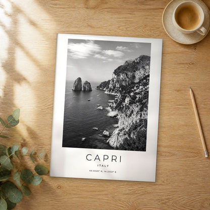 Unframed Capri black and white travel poster on a wooden table