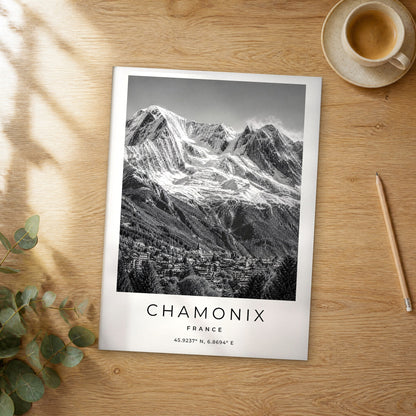 Unframed Chamonix black and white travel poster on a wooden table