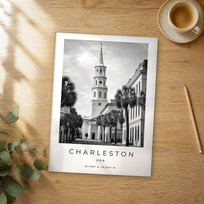 Unframed Charleston black and white travel poster on a wooden table