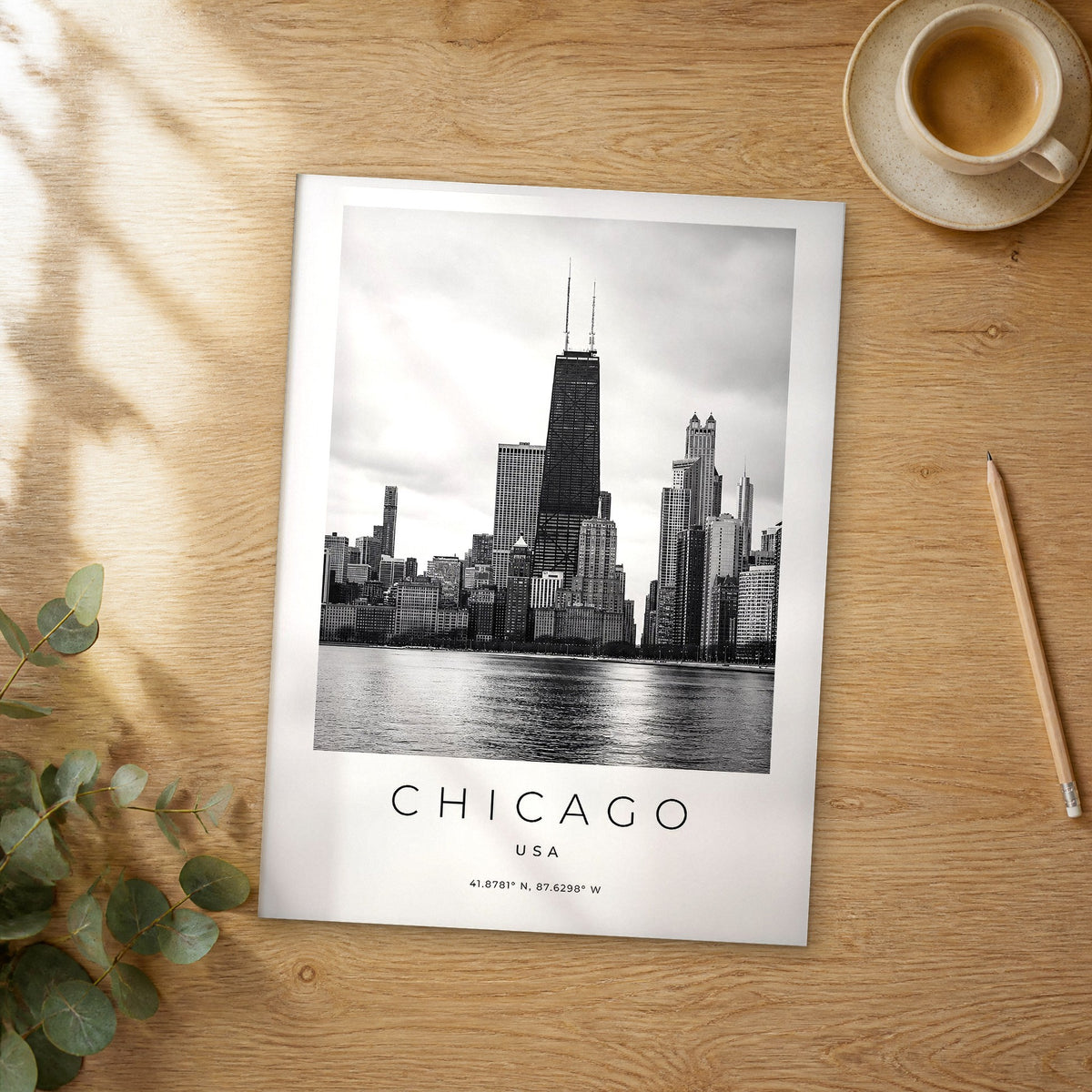 Unframed Chicago black and white travel poster on a wooden table
