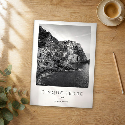 Unframed Cinque Terre black and white travel poster on a wooden table