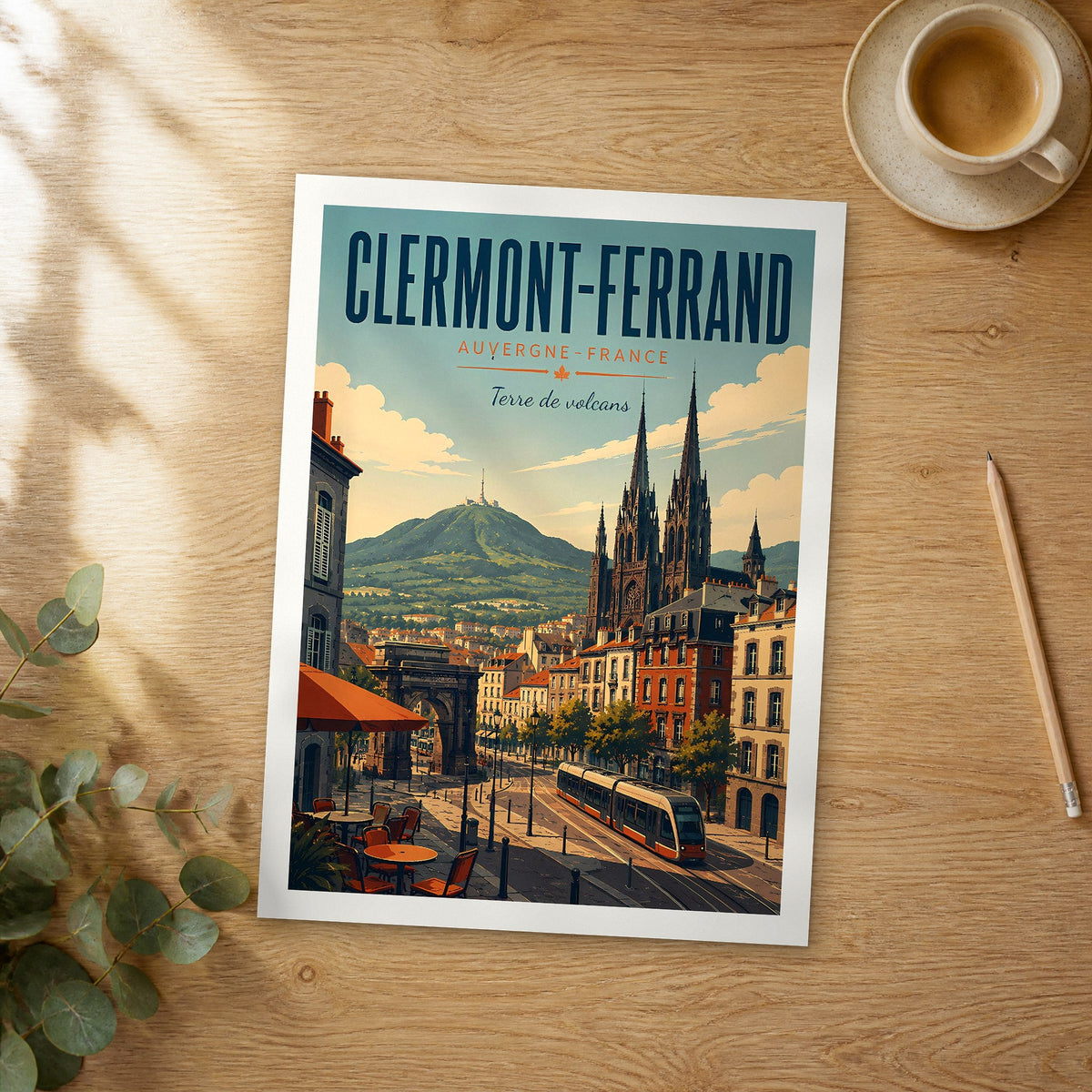 Unframed Clermont-Ferrand retro travel poster on a wooden table