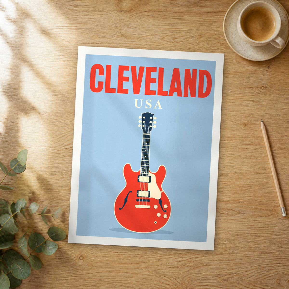 Unframed Cleveland pop art travel poster on a wooden table