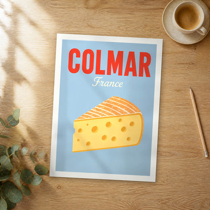 Unframed Colmar pop art travel poster on a wooden table