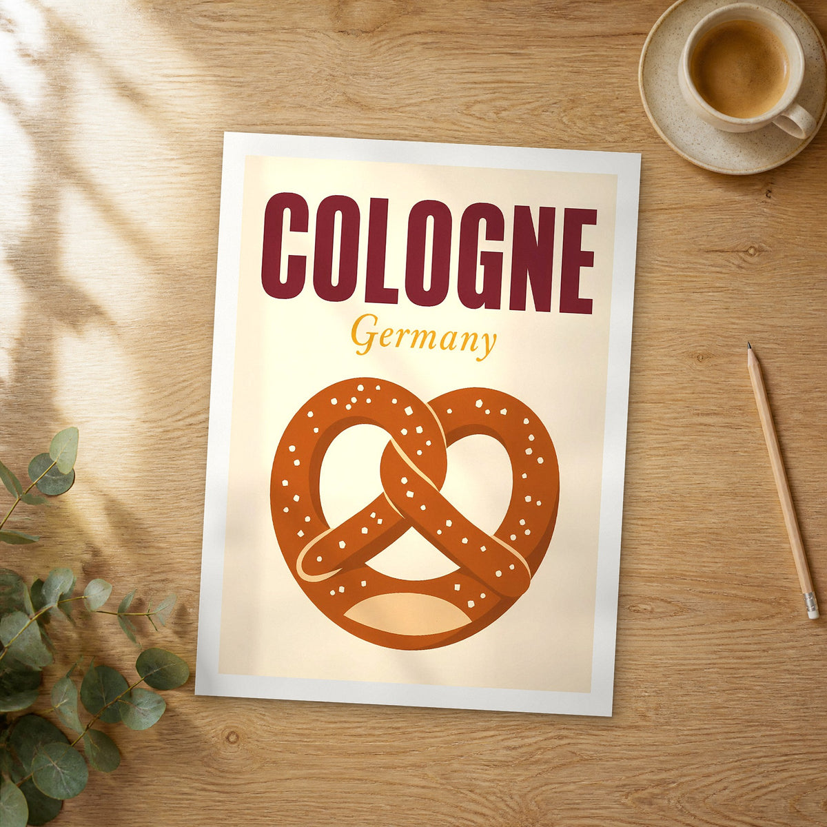 Unframed Cologne pop art travel poster on a wooden table