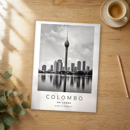 Unframed Colombo black and white travel poster on a wooden table