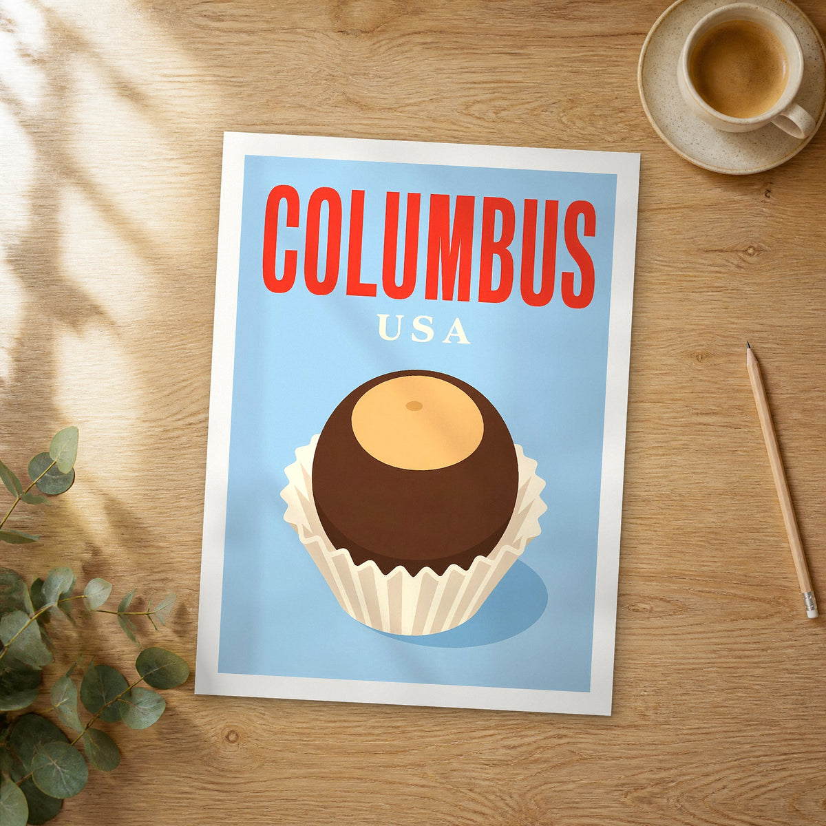 Unframed Columbus pop art travel poster on a wooden table
