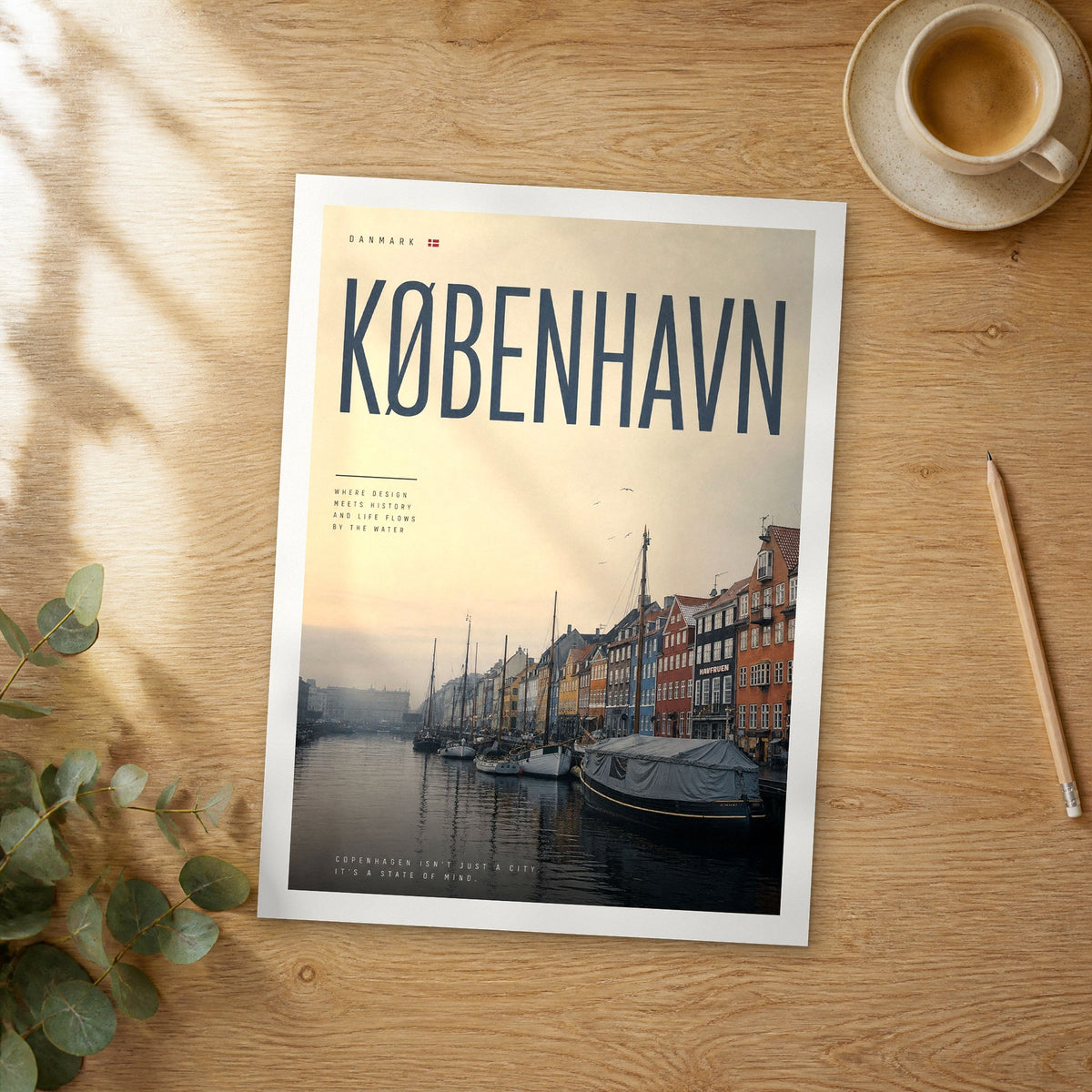 Unframed Copenhagen Nyhavn Harbour bold typography travel poster on a wooden table