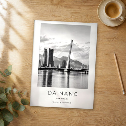 Unframed Da Nang black and white travel poster on a wooden table