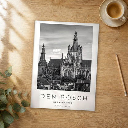 Unframed Den Bosch black and white travel poster on a wooden table