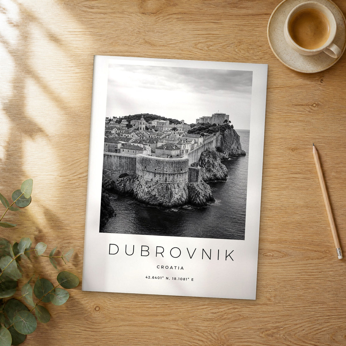 Unframed Dubrovnik black and white travel poster on a wooden table