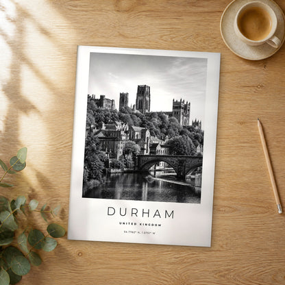 Unframed Durham black and white travel poster on a wooden table
