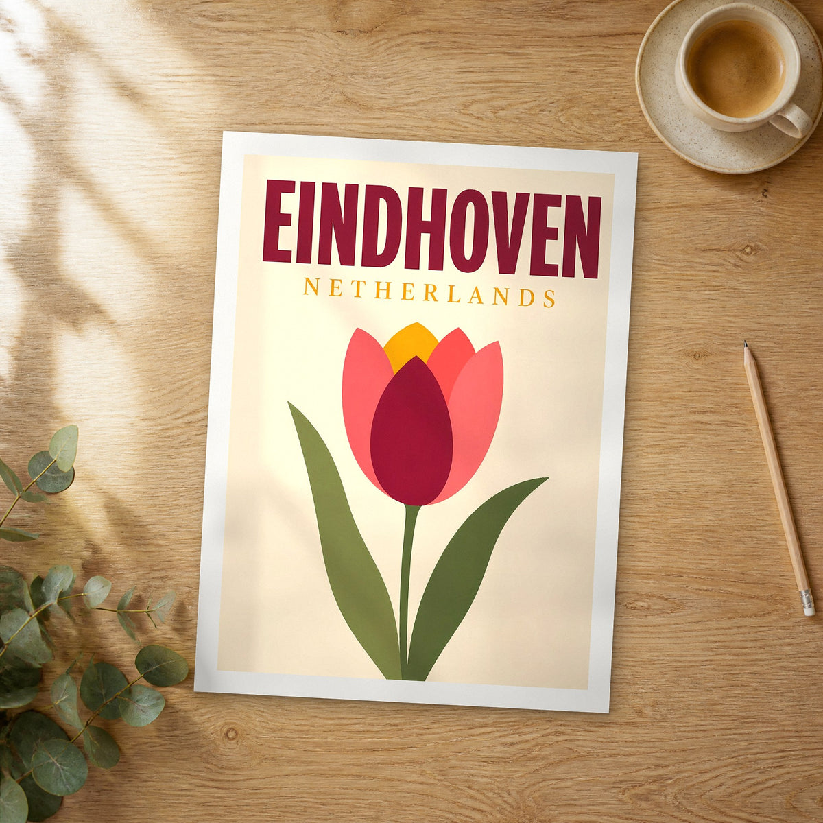 Unframed Eindhoven pop art travel poster on a wooden table