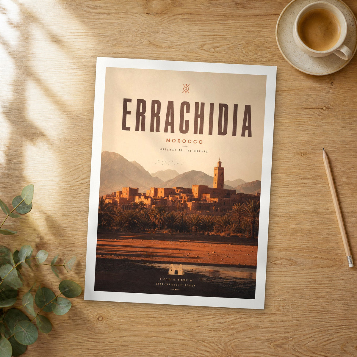 Unframed Errachidia bold typography travel poster on a wooden table