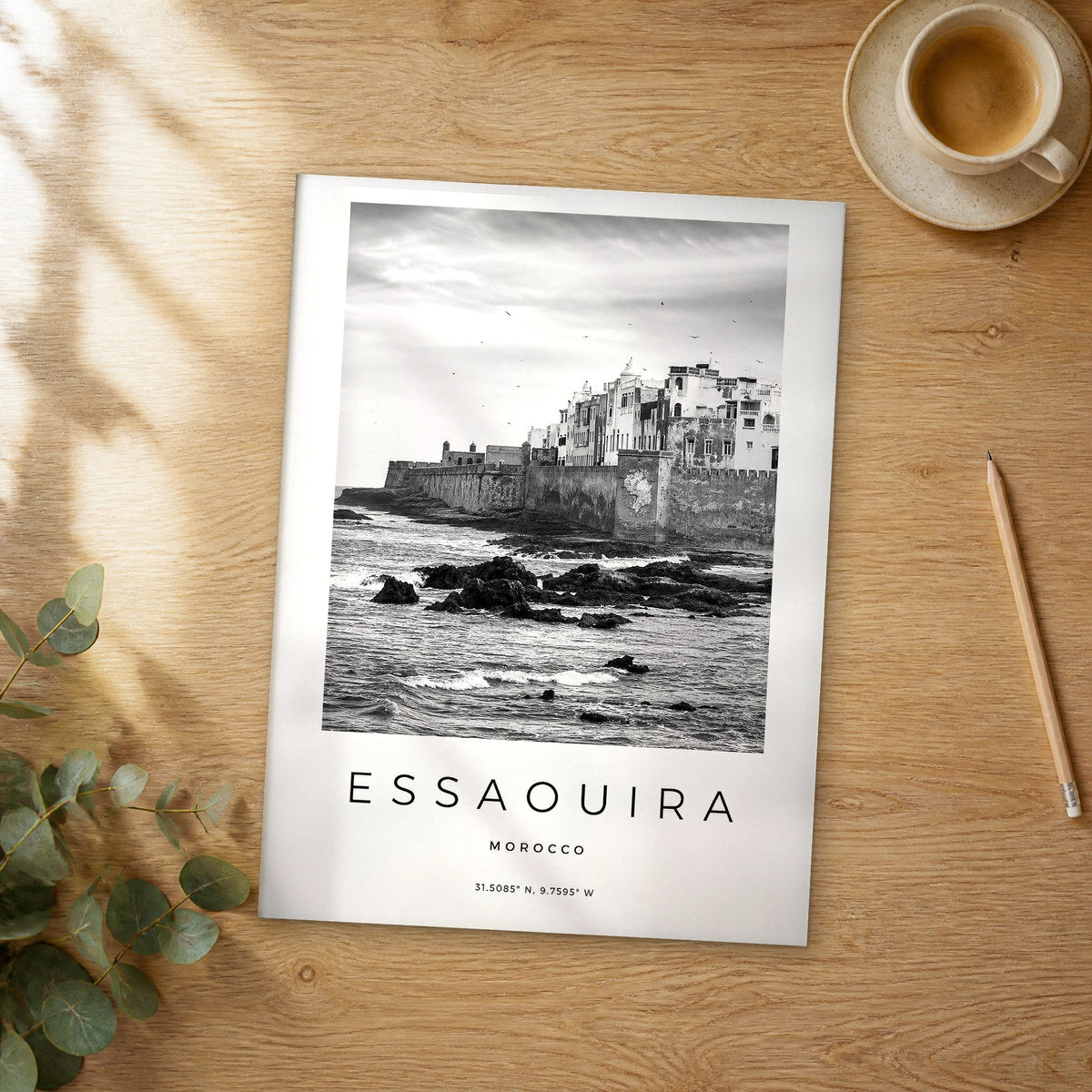 Unframed Essaouira black and white travel poster on a wooden table