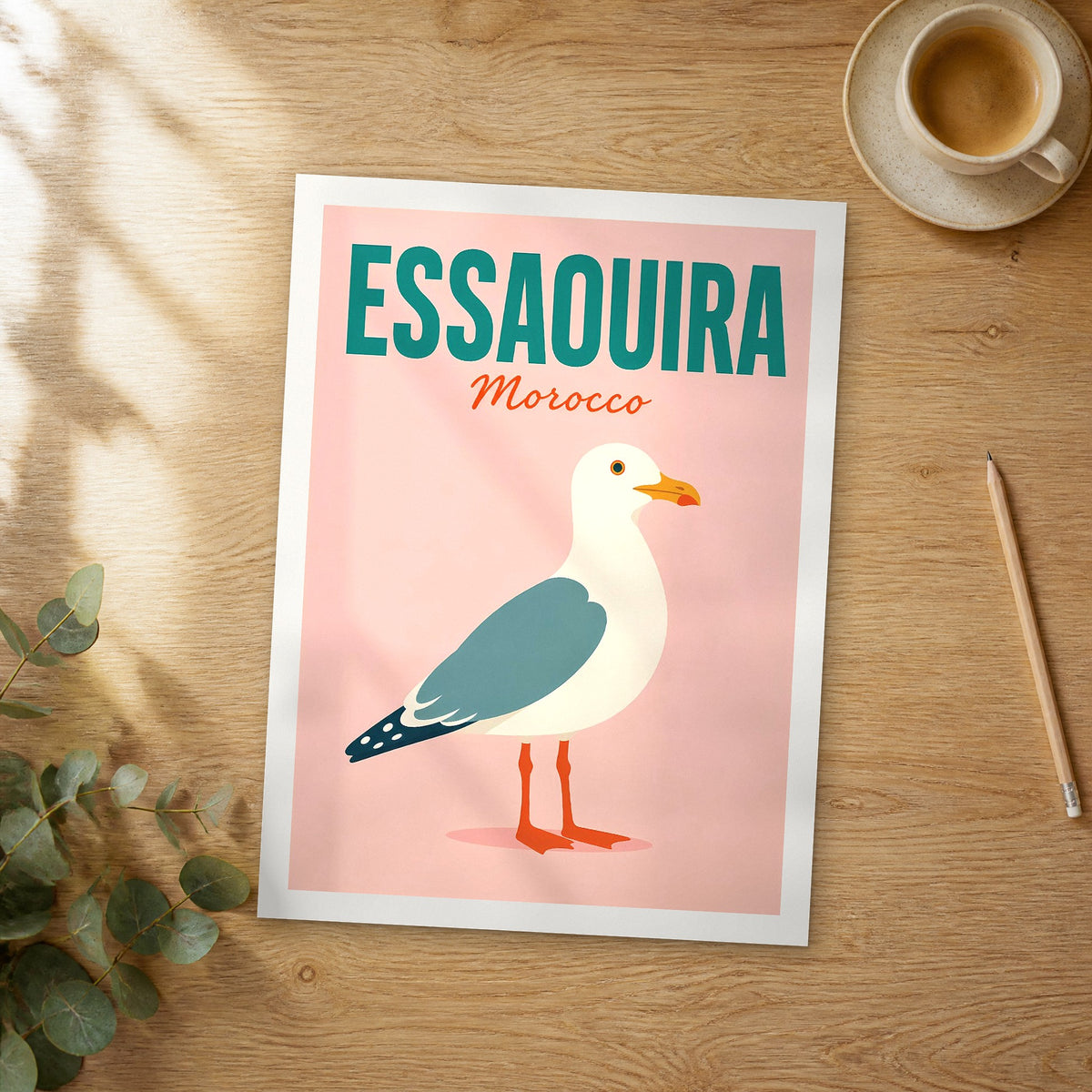Unframed Essaouira pop art travel poster on a wooden table