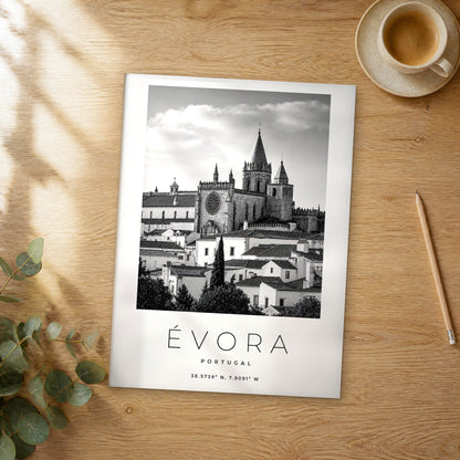 Unframed Évora black and white travel poster on a wooden table