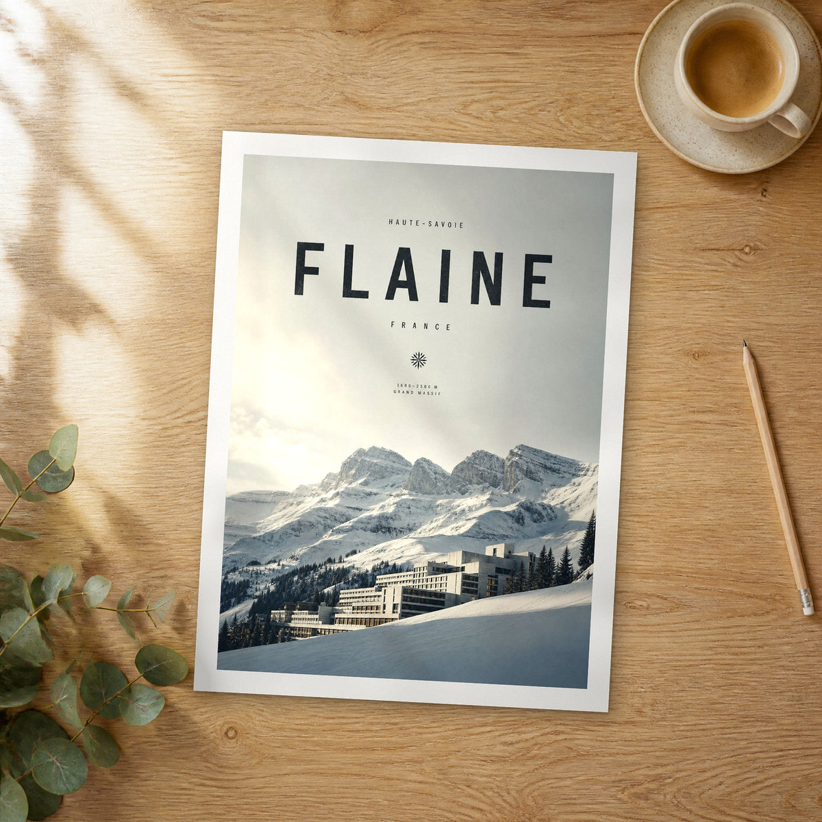 Unframed Flaine bold typography travel poster on a wooden table