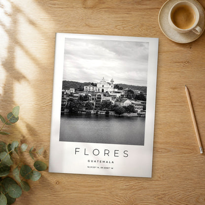 Unframed Flores black and white travel poster on a wooden table