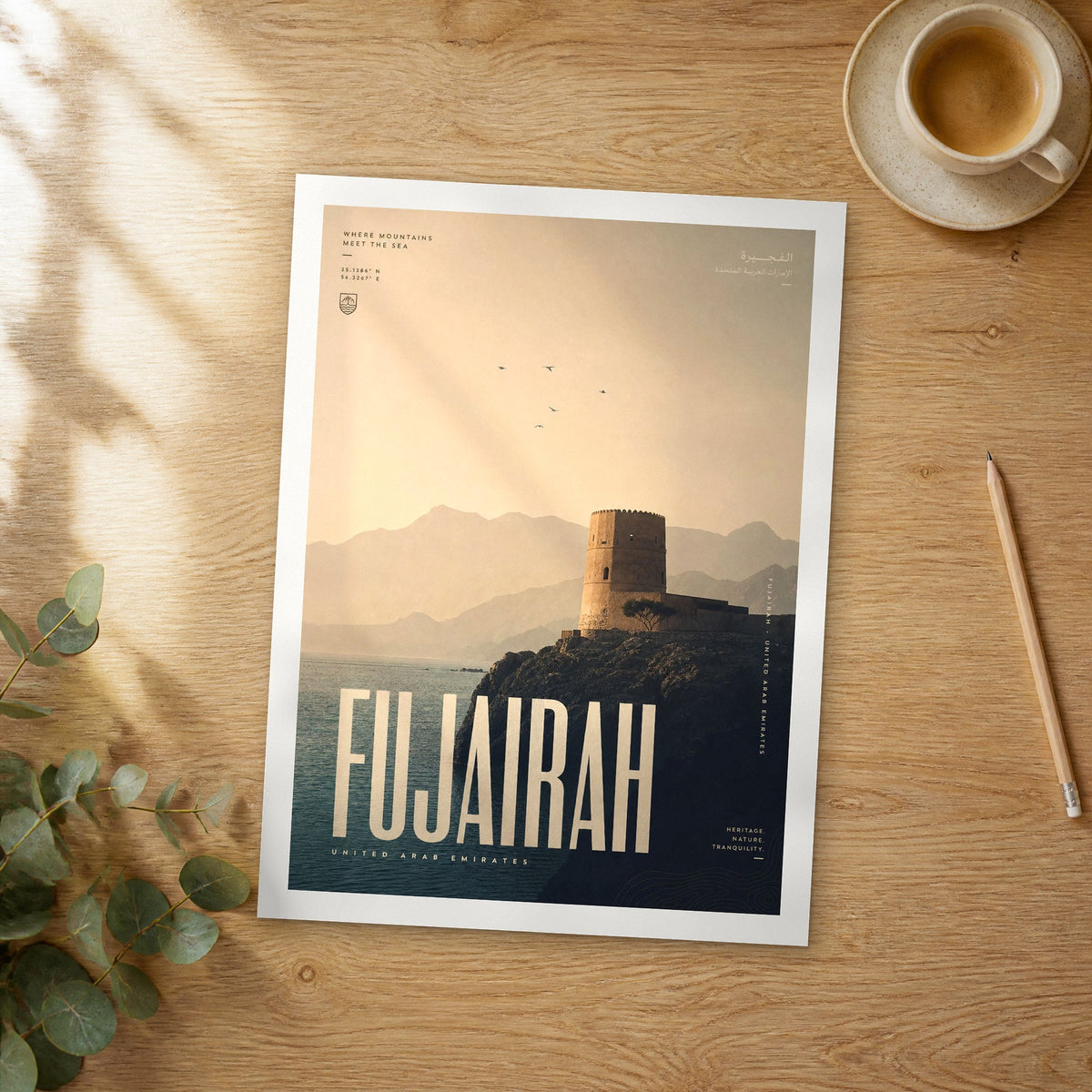 Unframed Fujairah bold typography travel poster on a wooden table