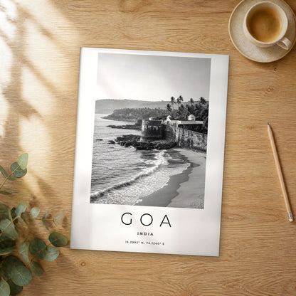 Unframed Goa black and white travel poster on a wooden table