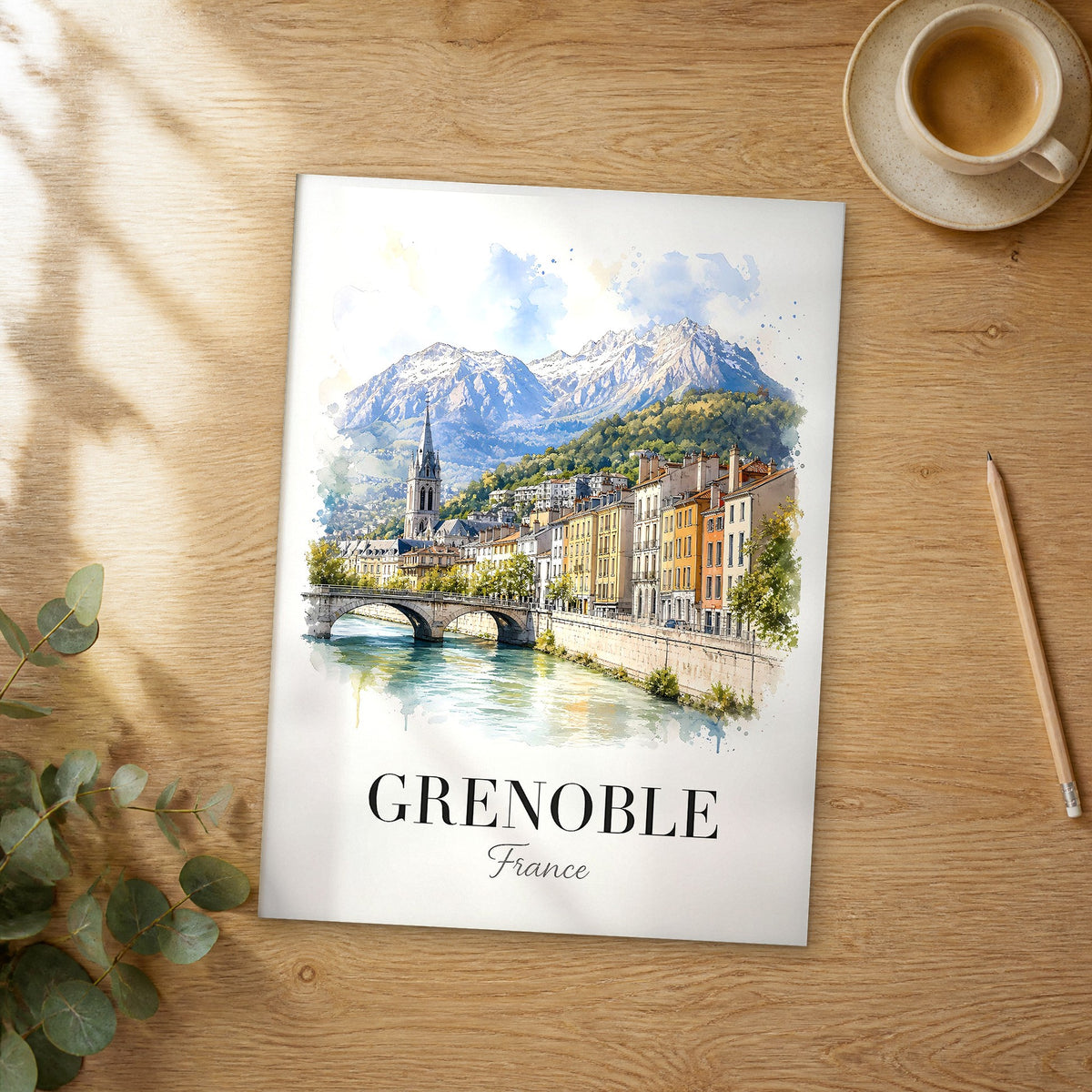 Unframed Grenoble watercolor travel poster on a wooden table