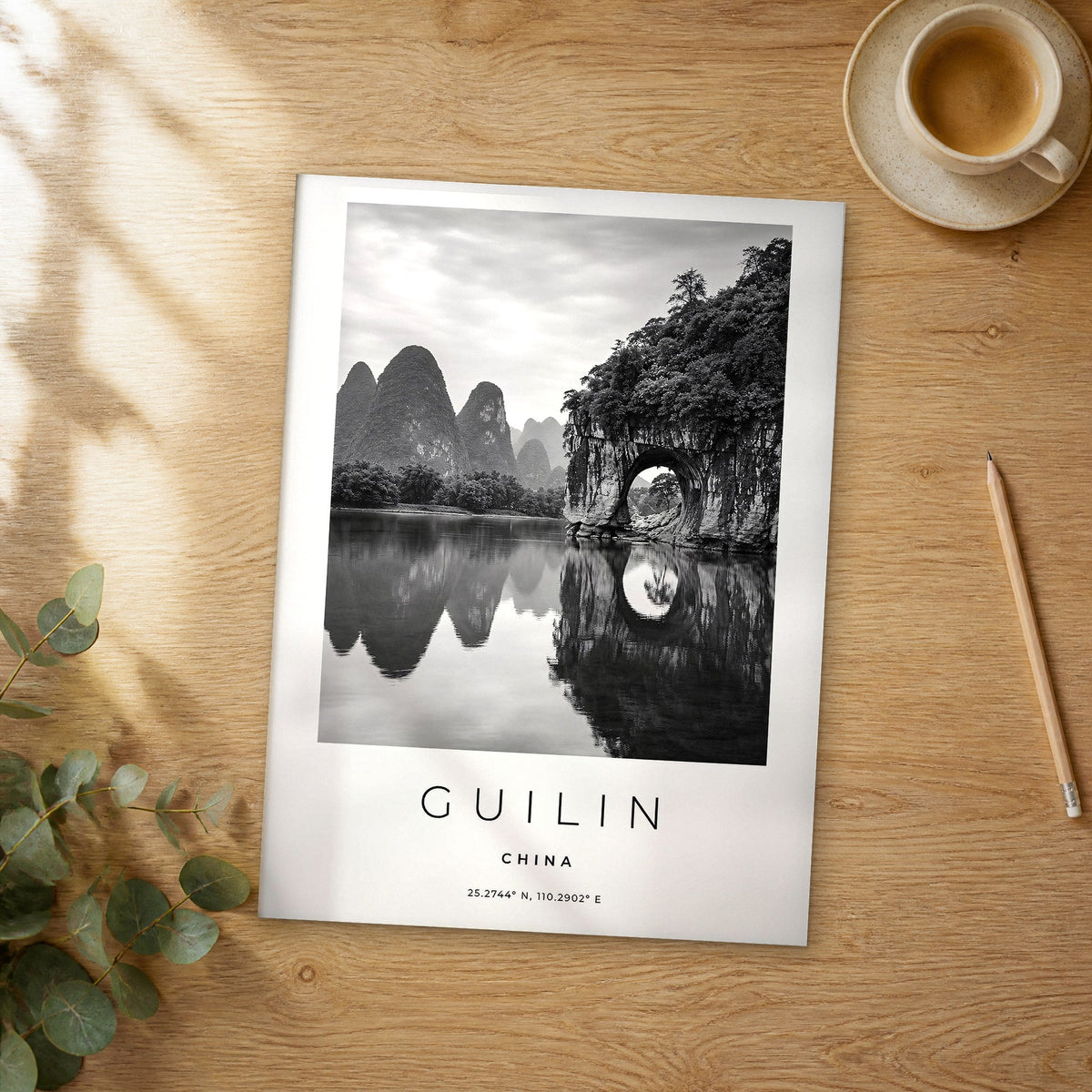 Unframed Guilin black and white travel poster on a wooden table