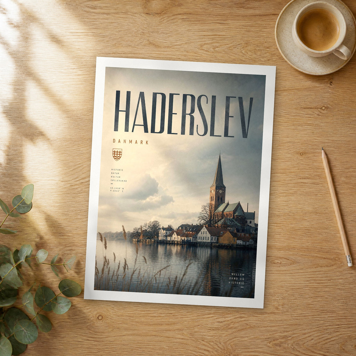 Unframed Haderslev bold typography travel poster on a wooden table