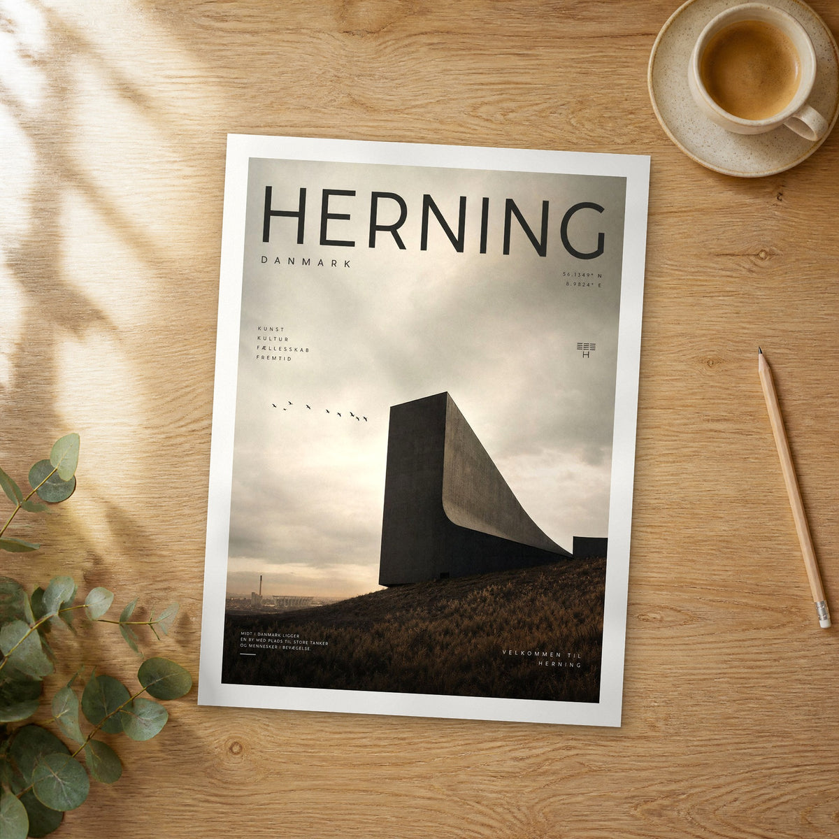 Unframed Herning bold typography travel poster on a wooden table