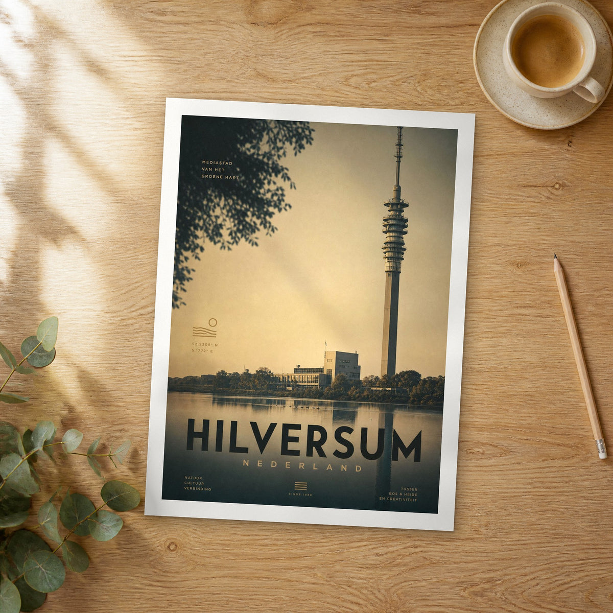 Unframed Hilversum bold typography travel poster on a wooden table