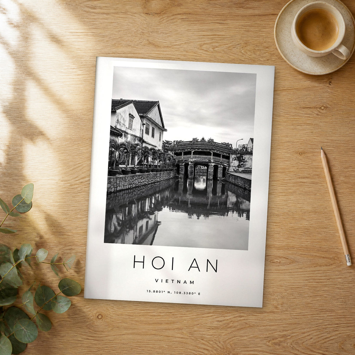 Unframed Hoi An black and white travel poster on a wooden table