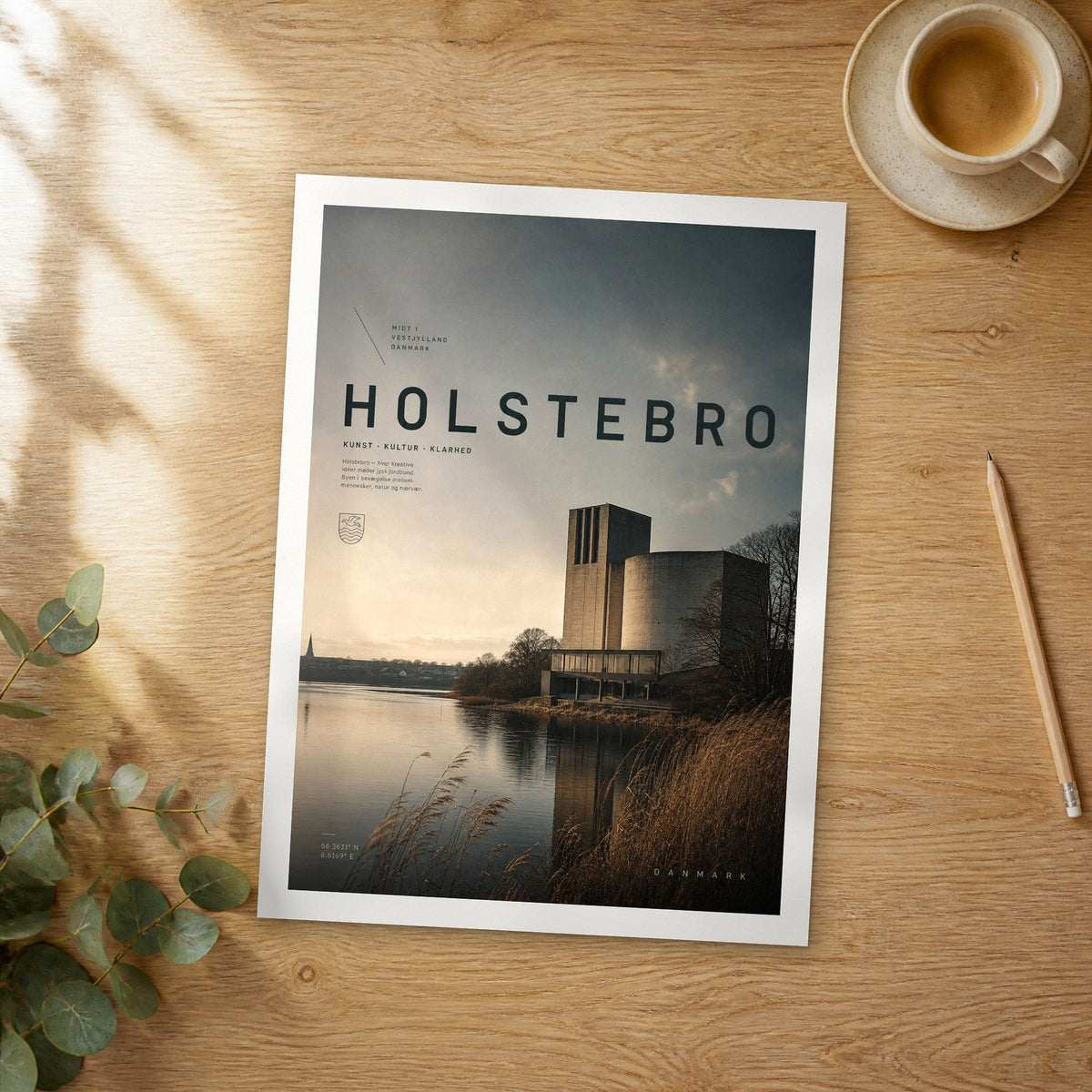 Unframed Holstebro bold typography travel poster on a wooden table