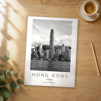 Unframed Hong Kong black and white travel poster on a wooden table