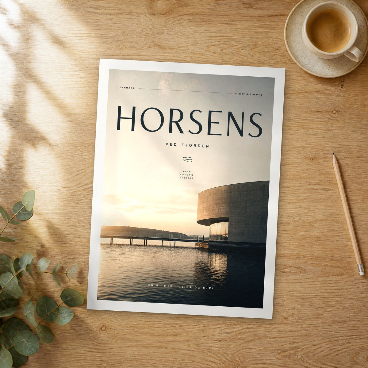 Unframed Horsens bold typography travel poster on a wooden table