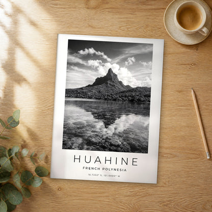 Unframed Huahine black and white travel poster on a wooden table