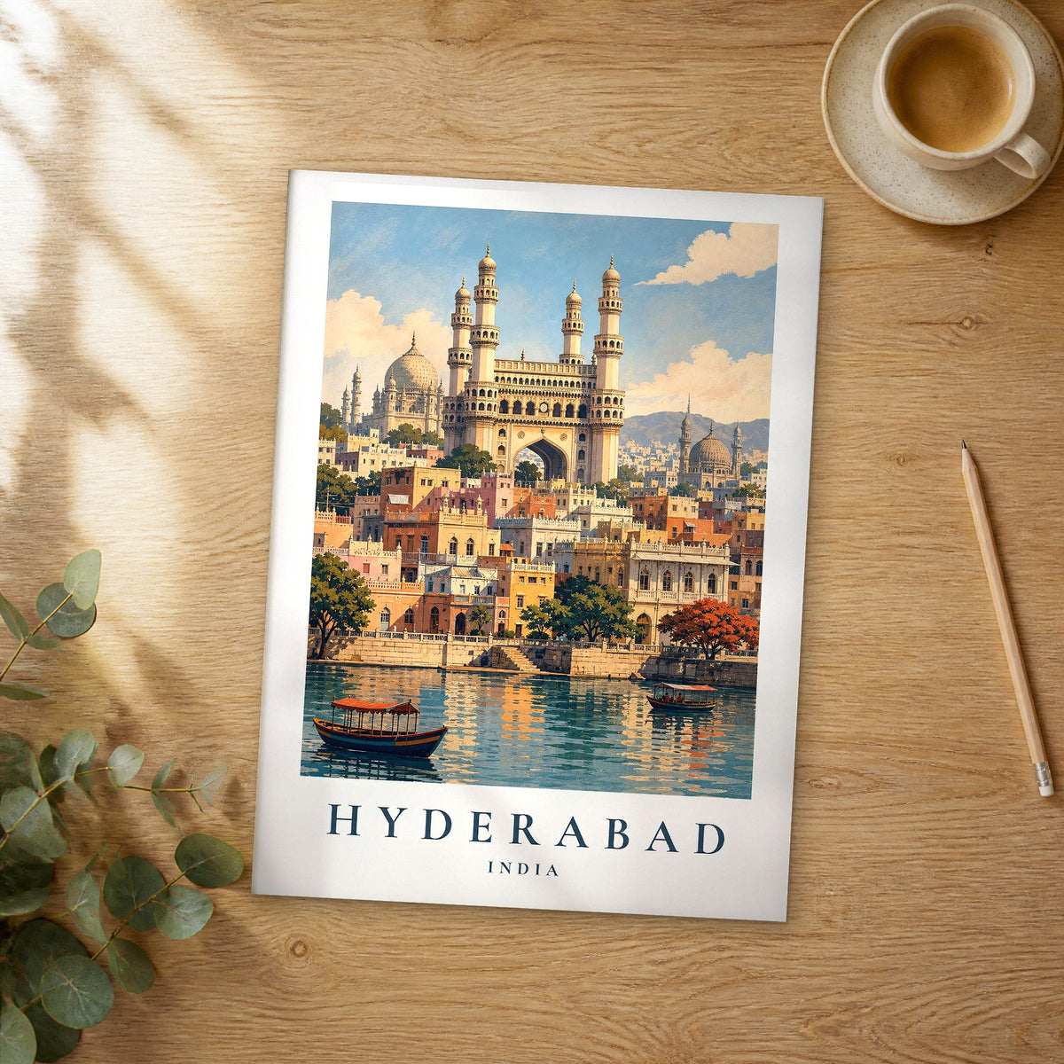 Unframed Hyderabad vintage travel poster on a wooden table