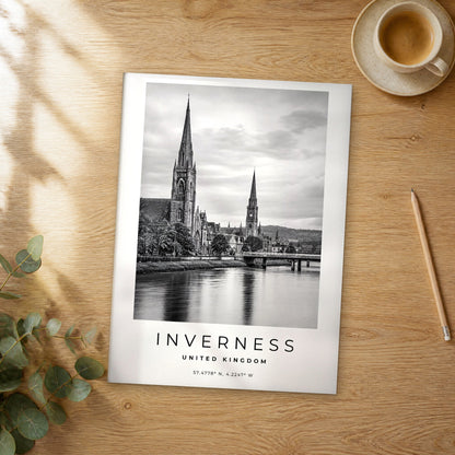 Unframed Inverness black and white travel poster on a wooden table