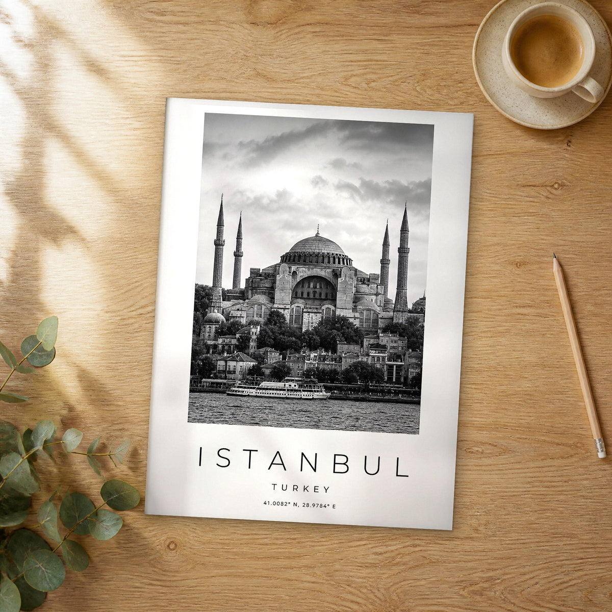 Unframed Istanbul black and white travel poster on a wooden table
