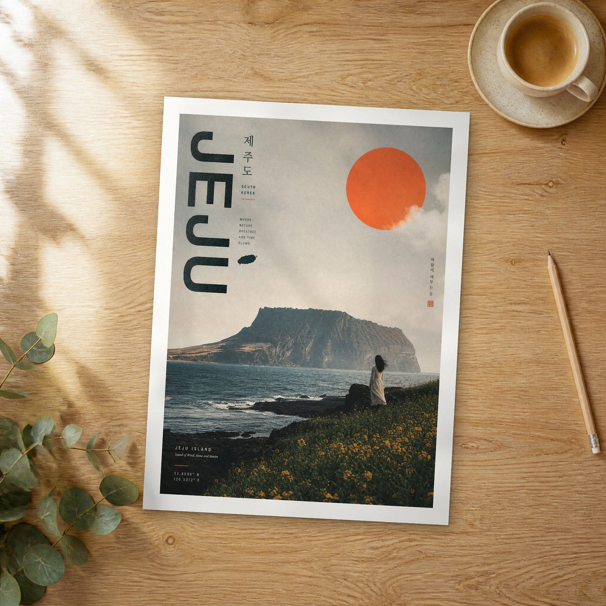 Unframed Jeju Island bold typography travel poster on a wooden table