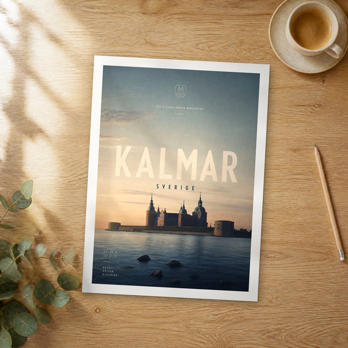 Unframed Kalmar bold typography travel poster on a wooden table