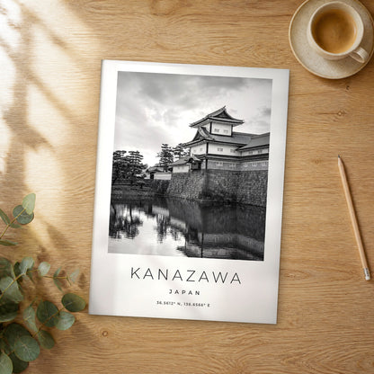 Unframed Kanazawa black and white travel poster on a wooden table