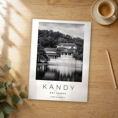 Unframed Kandy black and white travel poster on a wooden table