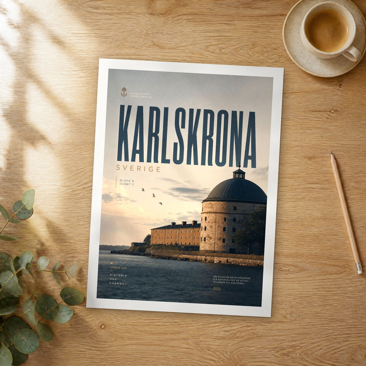 Unframed Karlskrona bold typography travel poster on a wooden table