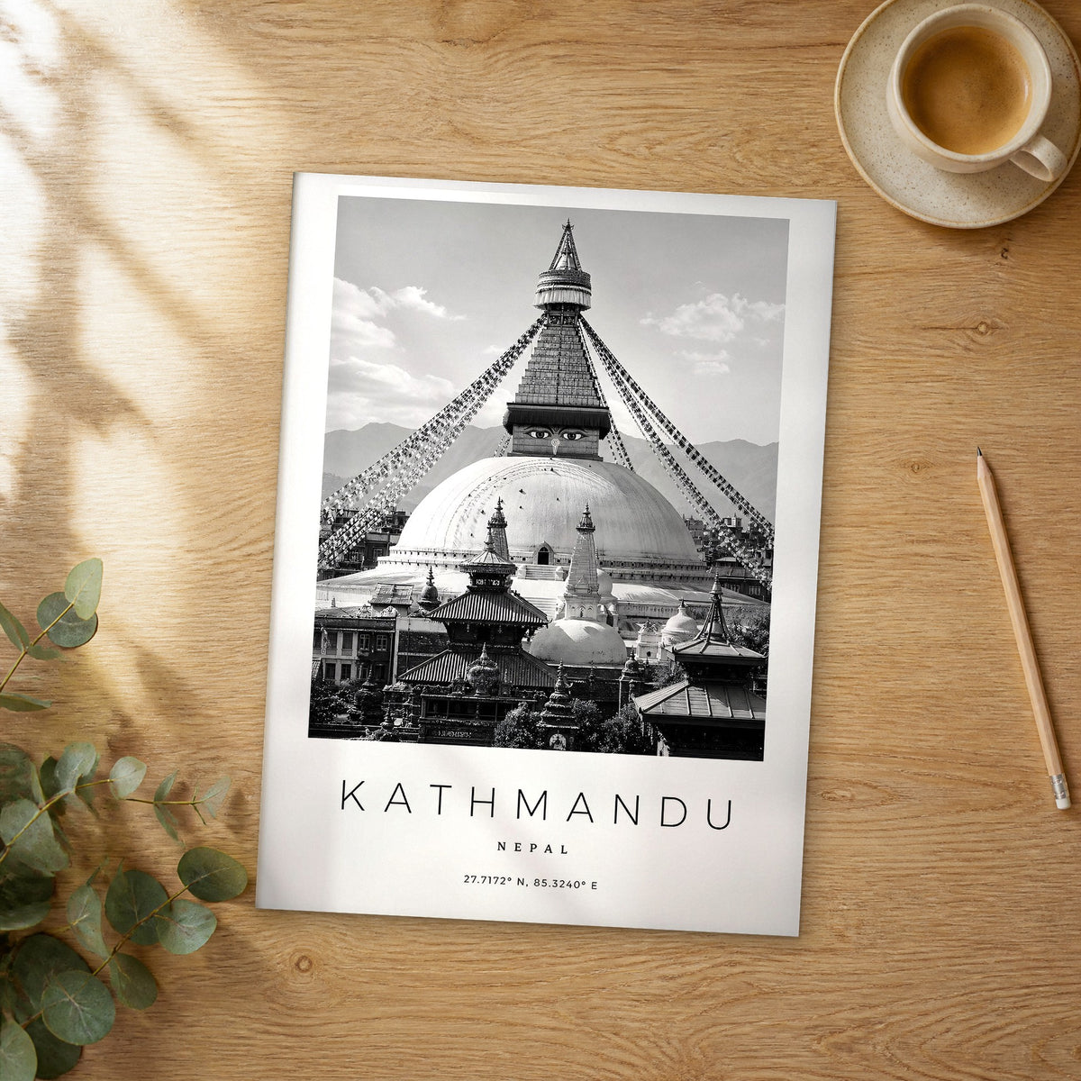 Unframed Kathmandu black and white travel poster on a wooden table