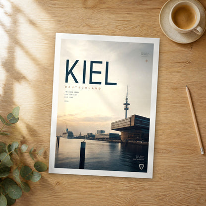 Unframed Kiel bold typography travel poster on a wooden table