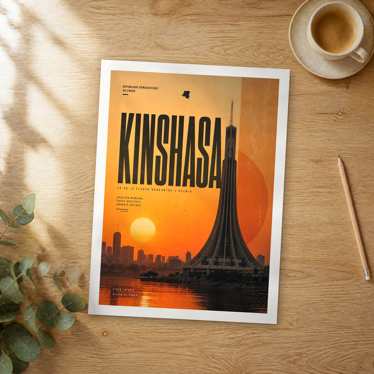 Unframed Kinshasa bold typography travel poster on a wooden table