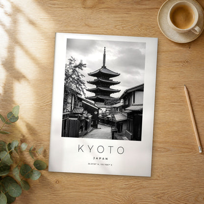 Unframed Kyoto black and white travel poster on a wooden table