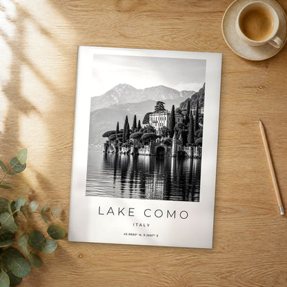 Unframed Lake Como black and white travel poster on a wooden table