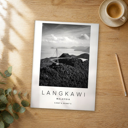 Unframed Langkawi black and white travel poster on a wooden table